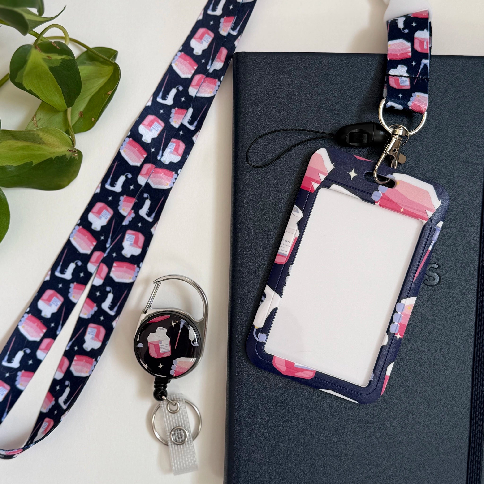 Cell culture card holder set including a lanyard, card holder, and retractable badge reel.
